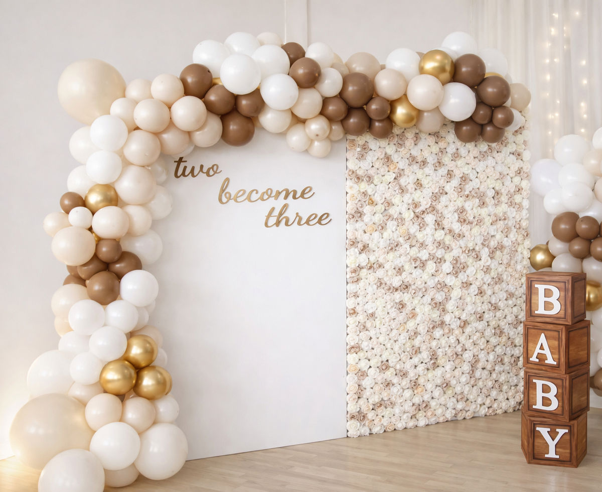 Neutral balloon display, flower wall and baby blocks